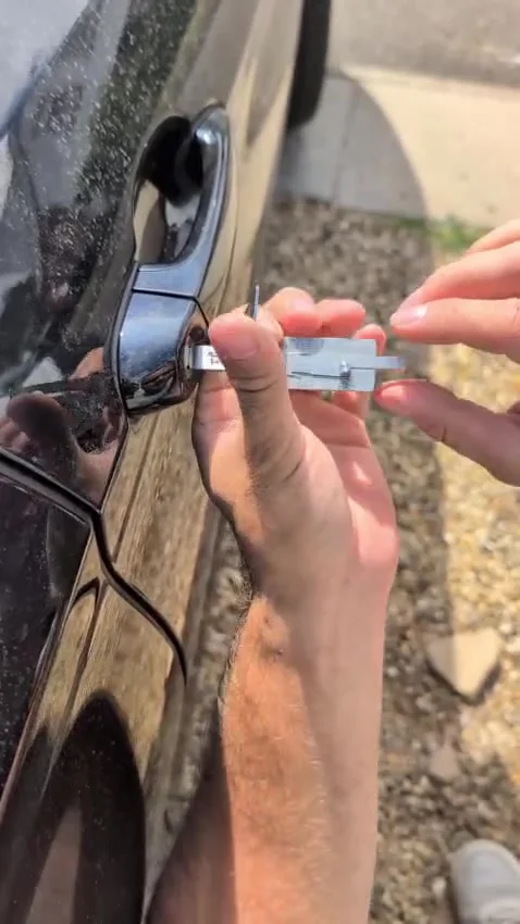 Auto locksmith using specialist pick tools to open a BMW 4 Series door in Daventry, Northamptonshire — emergency car opening