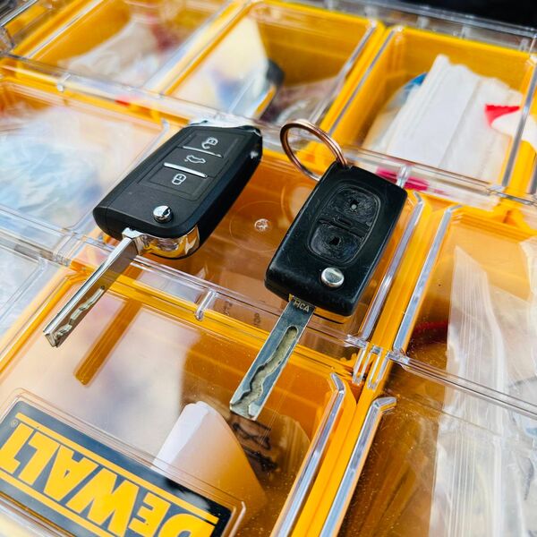 Car key fobs organized in professional equipment case