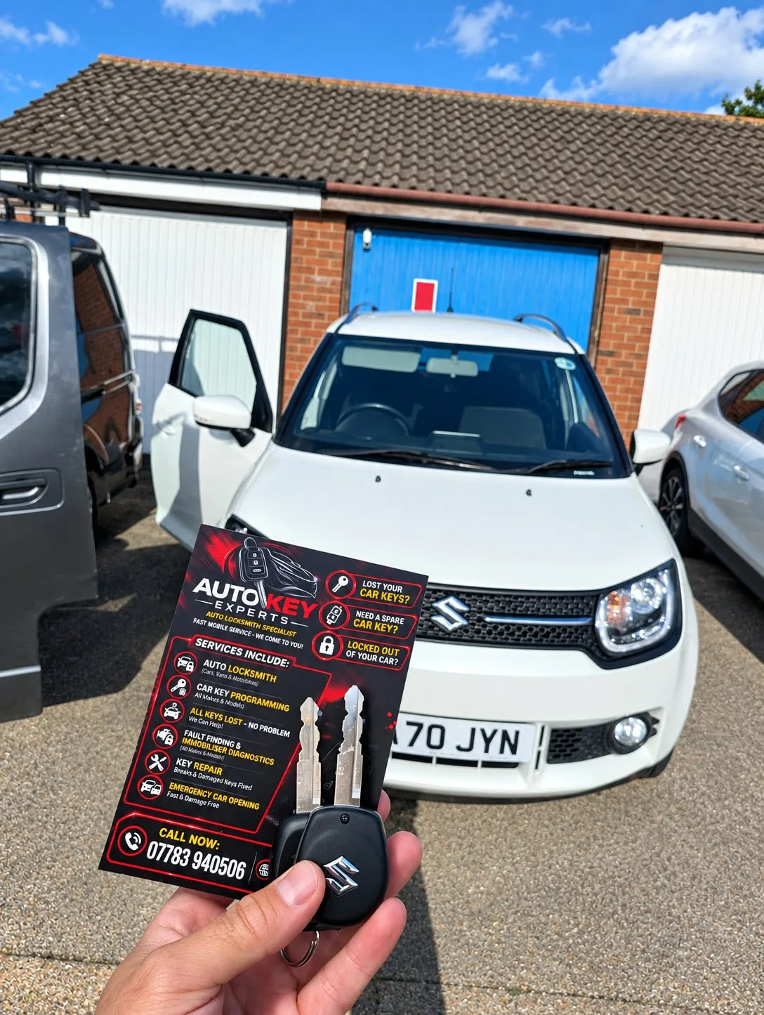 White Suzuki Ignis 2020 with new spare key and Auto Key Experts business card in Daventry
